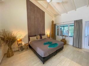 a bedroom with a large bed in a room at Puur Bonaire Boutique Resort in Belnem +63 photos