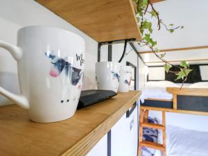 a coffee cup sitting on a counter in a room at Bluebelle Cow Shed 5 in Woodbridge