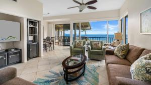 a living room with a view of the ocean at Kapalua Bay Villa 17B4 in Kapalua