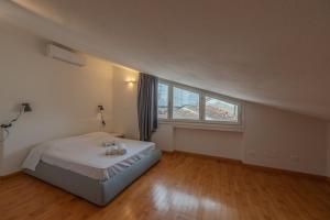 a bedroom with a bed with two teddy bears on it at Loft Empoli in Empoli