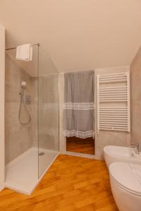 a bathroom with a shower and a toilet and a sink at Loft Empoli in Empoli