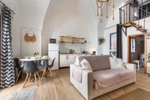 a living room with a couch and a table at La Casetta a Sannicola by BarbarHouse in Sannicola +6 photos
