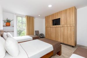 Postel nebo postele na pokoji v ubytování Hotel Prada