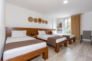 Postel nebo postele na pokoji v ubytování Hotel Prada