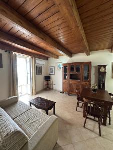 a living room with a couch and a table at Affaccio sul Mare in Tropea