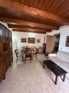 a living room with a table and a couch at Affaccio sul Mare in Tropea