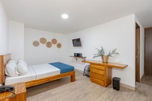 Postel nebo postele na pokoji v ubytování Hotel Prada