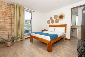 Postel nebo postele na pokoji v ubytování Hotel Prada