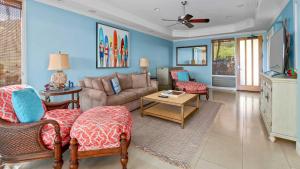 a living room with a couch and a table at Kapalua Bay Villa 18G2 in Kapalua