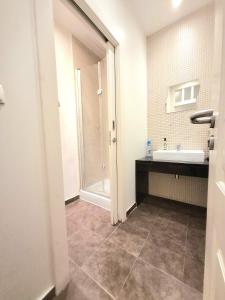 a bathroom with a sink and a shower at Happy at Chiado in Lisbon +43 photos