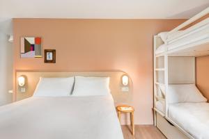 Ліжко або ліжка в номері greet Hôtel Prévessin Genève Aéroport