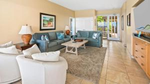 a living room with a couch and a table at Kapalua Bay Villa 21G2 in Kapalua