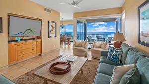 a living room with a couch and a table at Kapalua Bay Villa 21G2 in Kapalua