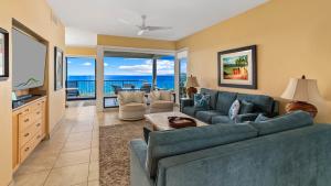 a living room with a couch and a table at Kapalua Bay Villa 21G2 in Kapalua