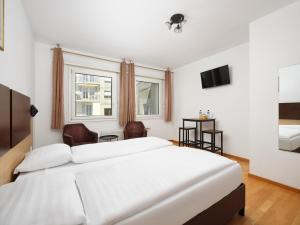 Ein Bett oder Betten in einem Zimmer der Unterkunft Bon Port