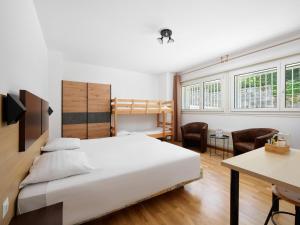 Ein Bett oder Betten in einem Zimmer der Unterkunft Bon Port
