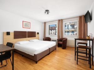 Ein Bett oder Betten in einem Zimmer der Unterkunft Bon Port