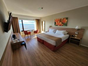 Cama ou camas em um quarto em Xelena Hotel & Suites