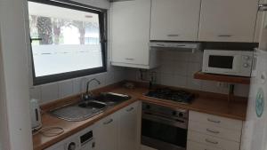 Kuchyň nebo kuchyňský kout v ubytování San Alfonso del Mar Fragata 209