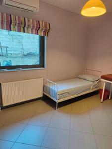 Katil atau katil-katil dalam bilik di Maria's Apartment +3 gambar