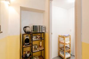 Η κουζίνα ή μικρή κουζίνα στο Studio Zen con Parcheggio gratuito e Check In Automatico 24 ore su 24 +4 φωτογραφίες