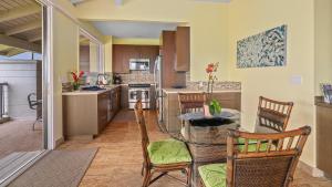 a kitchen with a table and chairs in a room at Kapalua Bay Villa 30B1 in Kapalua +29 photos