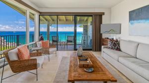 a living room with a couch and a table at Kapalua Bay Villa 30B2 in Kapalua