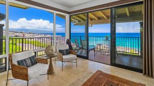a living room with a view of the ocean at Kapalua Bay Villa 30B2 in Kapalua