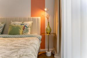 Postel nebo postele na pokoji v ubytování Vanagupe FRIDA apartments & Pusynas SPA