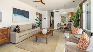 a living room with a couch and a table at Kapalua Bay Villa 30B2 in Kapalua +34 photos