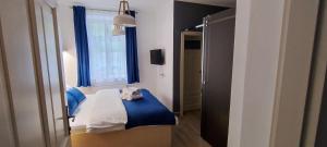 Postel nebo postele na pokoji v ubytování Vila Krupička