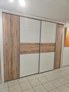 a pair of sliding garage doors in a room at Casa Home-Art in Biasca +18 photos