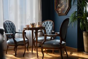 a dining room with two chairs and a table at Palace Hotel in Viareggio