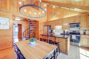 a kitchen with a large wooden table and chairs at Walk to Ski Slopes Sugar Mountain Unit with Balcony in Sugar Mountain