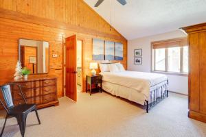 a bedroom with a bed and a desk and a mirror at Walk to Ski Slopes Sugar Mountain Unit with Balcony in Sugar Mountain