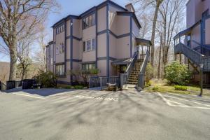 a large building with a staircase in front of it at Walk to Ski Slopes Sugar Mountain Unit with Balcony in Sugar Mountain