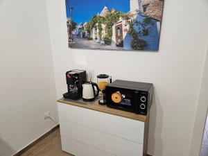 Příslušenství pro přípravu čaje a kávy v ubytování Vincotto's home garden