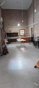 a large room with tables and chairs in it at Sueño Cumplido in Goya