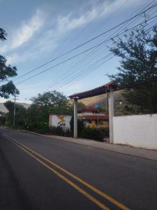 a road with a gas station on the side of the road at Sea Natural in San Gil +72 photos