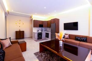 a living room with a couch and a tv at Medina residency in Tangier