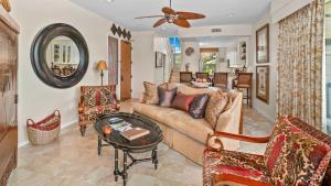 a living room with a couch and a table at Kapalua Bay Villa 35B2 in Kapalua