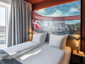 Postel nebo postele na pokoji v ubytování B&B HOTEL Aalborg