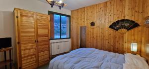Una cama o camas en una habitación de Rifugio dei Pini