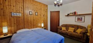 Una cama o camas en una habitación de Rifugio dei Pini