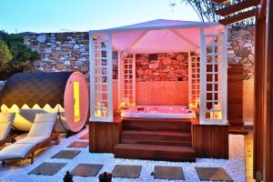 A bed or beds in a room at Ventoura Studios & Apartments
