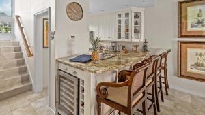 a kitchen with a island with a counter top at Kapalua Bay Villa 35B2 in Kapalua