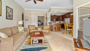 a living room with a couch and a table at Kapalua Golf Villa 15P78 in Kapalua