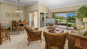 a living room with a couch and a table and chairs at Kapalua Golf Villa 15P78 in Kapalua