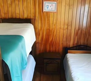 Postel nebo postele na pokoji v ubytování Algarrobo Cabaña a 2 cuadras Playa El Canelo+Wifi