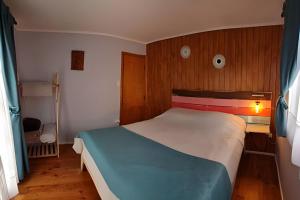 Postel nebo postele na pokoji v ubytování Algarrobo Cabaña a 2 cuadras Playa El Canelo+Wifi